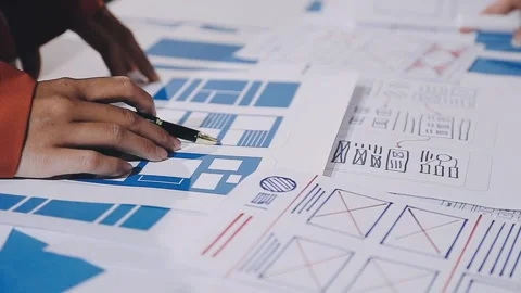 The designer team is designing the uxui system to make the uxui system work.. Stock Footage 308982750