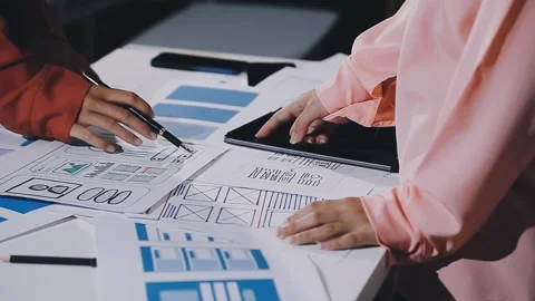 The designer team is designing the uxui system to make the uxui system work.. Stock Footage 308982754