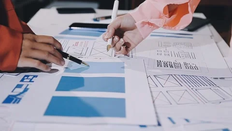 The designer team is designing the uxui system to make the uxui system work.. Stock Footage 308982759