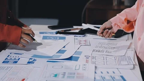 The designer team is designing the uxui system to make the uxui system work.. Stock Footage 308982762