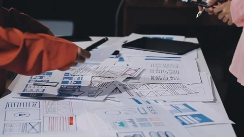 The designer team is designing the uxui system to make the uxui system work.. Stock Footage 308982763