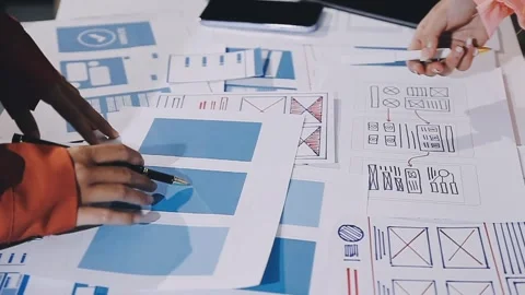 The designer team is designing the uxui system to make the uxui system work.. Stock Footage 308982765