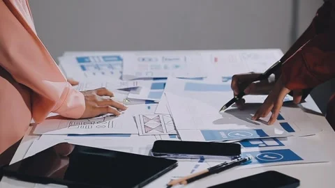 The designer team is designing the uxui system to make the uxui system work.. Stock Footage 308982766
