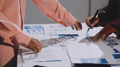 The designer team is designing the uxui system to make the uxui system work.. Stock Footage 308982767