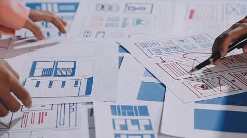 The designer team is designing the uxui system to make the uxui system work.. Stock Footage 308982784