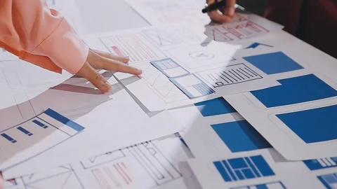 The designer team is designing the uxui system to make the uxui system work.. Stock Footage 308982797