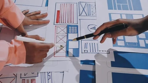 The designer team is designing the uxui system to make the uxui system work.. Stock Footage 308982799