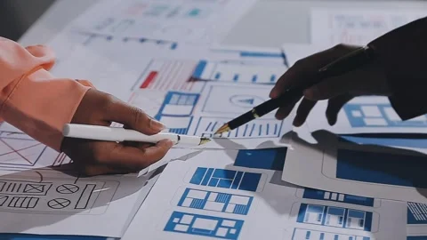 The designer team is designing the uxui system to make the uxui system work.. Stock Footage 308982800