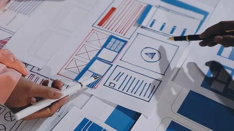The designer team is designing the uxui system to make the uxui system work.. Stock Footage 308982804