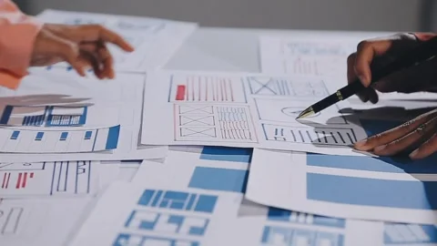 The designer team is designing the uxui system to make the uxui system work.. Stock Footage 308982807