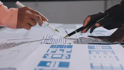 The designer team is designing the uxui system to make the uxui system work.. Stock Footage 308982812