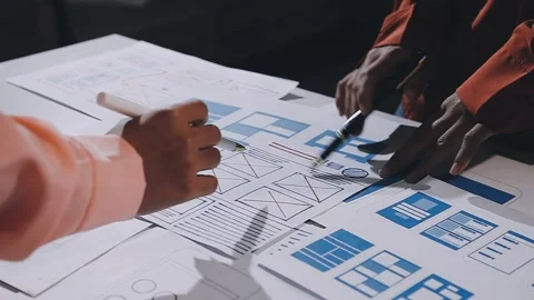 The designer team is designing the uxui system to make the uxui system work.. Stock Footage 308982832