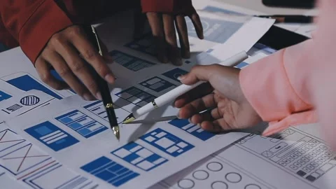 The designer team is designing the uxui system to make the uxui system work.. Stock Footage 308982834