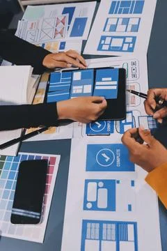 The designer team is designing the uxui system to make the uxui system work.. Stock-Fotos