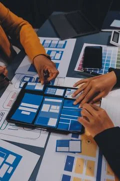 The designer team is designing the uxui system to make the uxui system work.. Stock-Fotos
