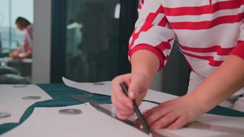 Designer traces garment pattern Stock Footage 348191472