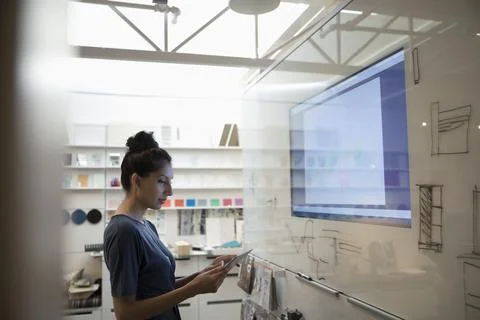 Designer using digital tablet at screen in creative office Stock Photos
