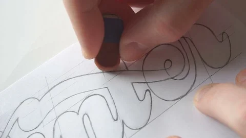 Designer using eraser tool for creating lettering Stock Footage 72221243