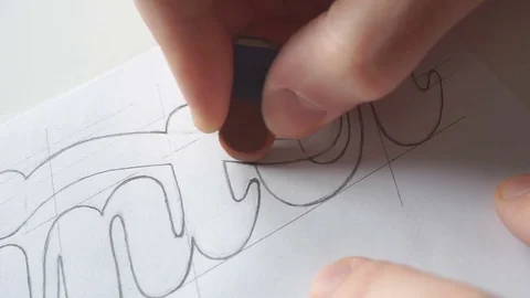 Designer using eraser tool for creating lettering Stock Footage 72221622