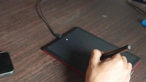 Designer using graphic tablet Stock Footage 302612402