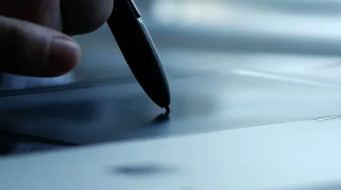 Designer using graphics stylus on computer, zoom out Stock Footage 48769149