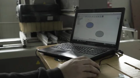 Designer using laptop to constructs components in industrial wood production. Stock Footage 87827095