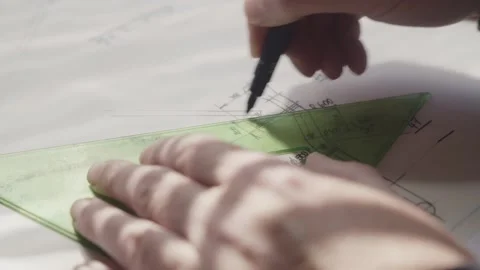 Designer Using Manual Triangle Ruler for Accurate Concept Blueprint Sketching Stock Footage 341926851