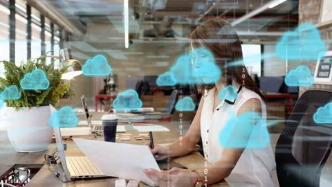 Designer using stylus checking sheets for tech, activating cloud binary overlay Stock Footage 333300785