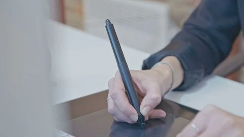 Designer Using a Stylus Stock Footage 76385789