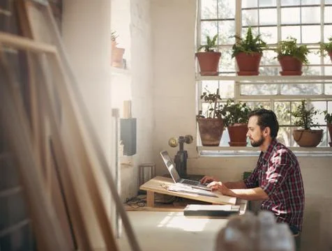 Designer working in a creative office space Stock Photos
