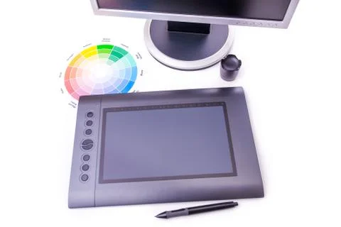 Designer working desk filled with computer,pen tablet Stock Photos