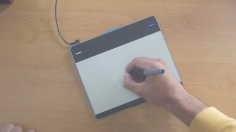 Designer working [digital drawing tablet] doodling away Stock Footage 68790324