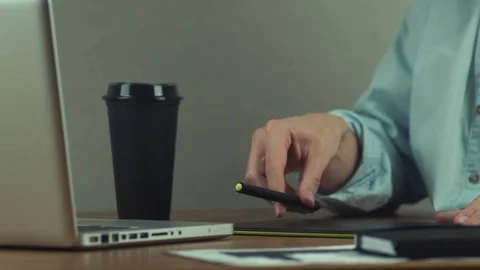 Designer working with graphics tablet, drinking coffee Stock Footage 81880355