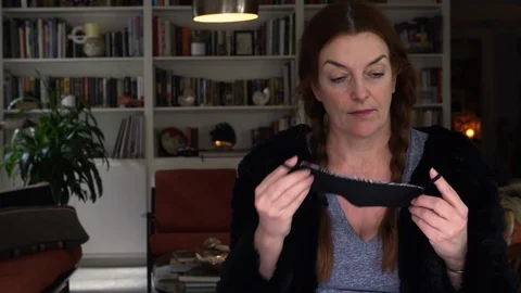 Designer working at home creates face masks as protection against viruses Stock Footage 127658249