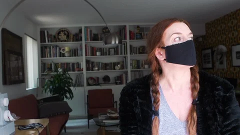 Designer working at home creates face masks as protection against viruses Stock Footage 127658287