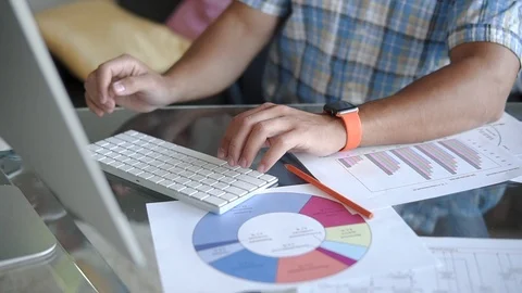 The designer is working on a project in the office Stock Footage 100576964