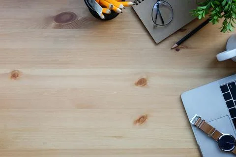 Designer workplace with laptop computer, notebook, glasses and pencil holder  Stock Photos
