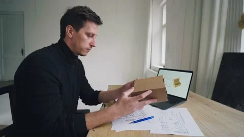 The designer works, develops the design of the box with the help of a computer Stock Footage 221277058