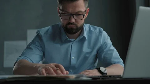 Designer works with the drawings, using the tablet. Loft office Video stock 112162059