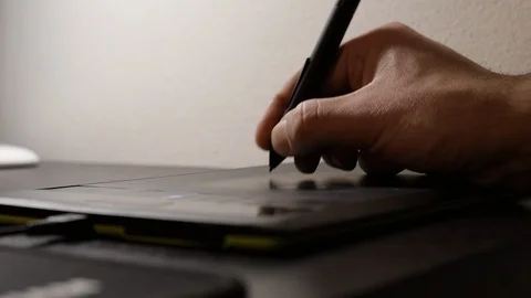 Designer works with graphics tablet. Close up shot Stock Footage 124878333