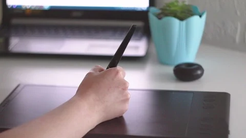 The designer works on a graphics tablet. Stock Footage 119111899
