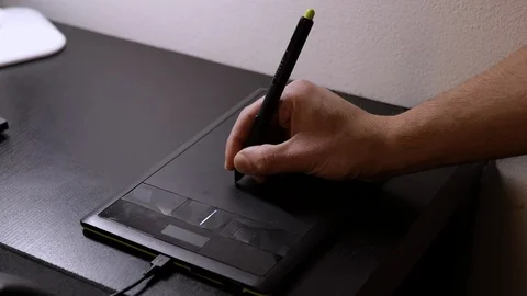 Designer works with graphics tablet. Medium shot. Side view Stock Footage 124878457
