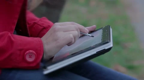 Designer works on the tablet using stylus Stock Footage 42971552