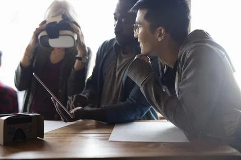 Designers and computer programmers with digital tablet testing and programming v Stock Photos