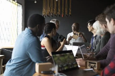 Designers and computer programmers discussing virtual reality simulator glasses Stock-Fotos