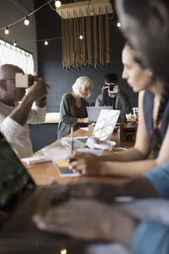 Designers and computer programmers testing and programming virtual reality simul 스톡 사진