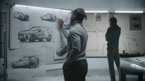 Designers developing electric car sketch Stock Footage 220905805