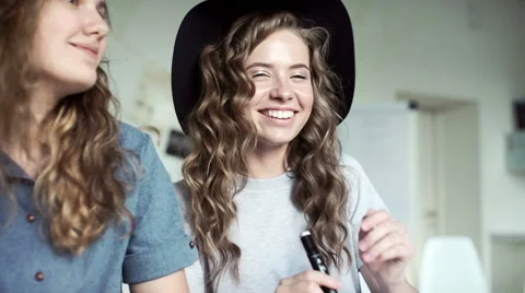 Designers draw sketches in the Studio. two attractive women working and smiling Stock Footage 64582969