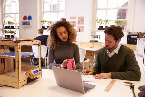 Designers Working With 3D Printer Discuss Prototype Stock Photos