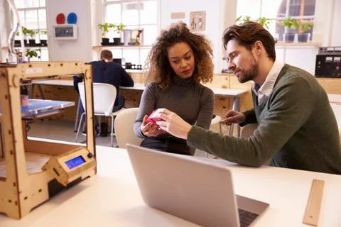 Designers Working With 3D Printer Discuss Prototype Stock Photos